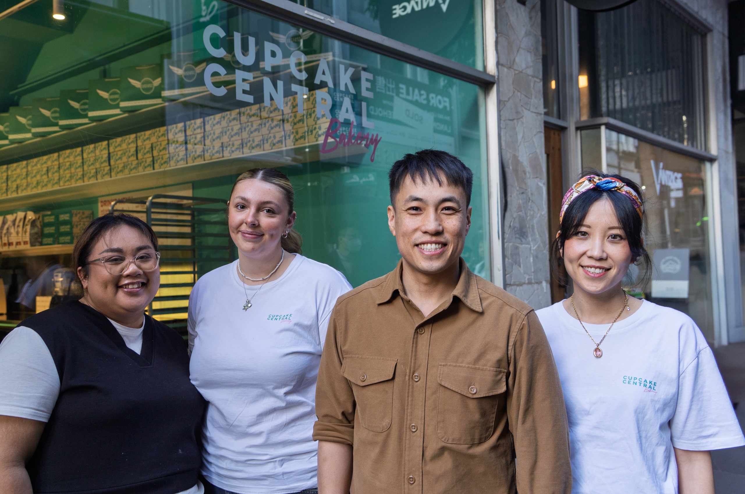 image of four people outside cupcake central
