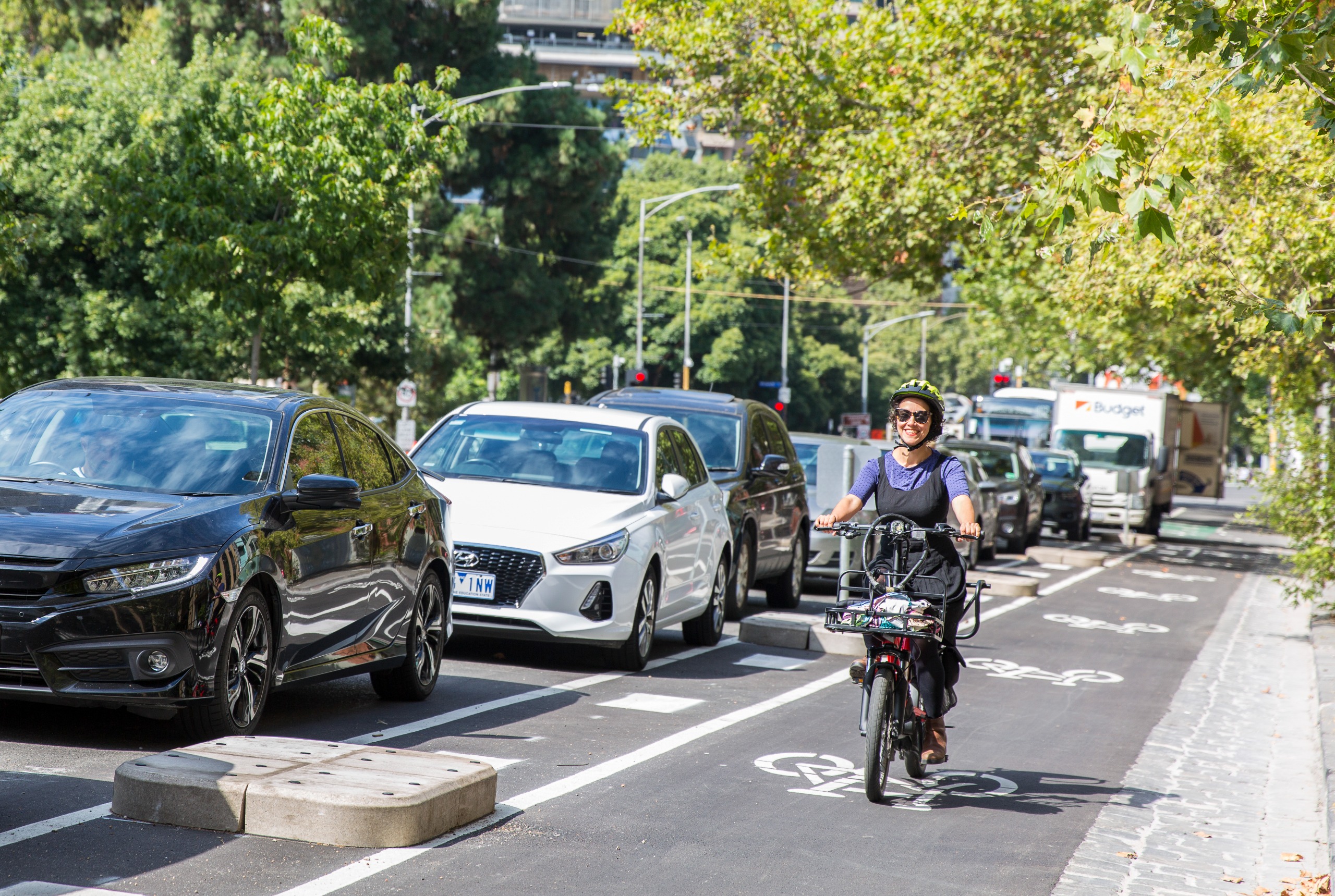 Woman cycling in bike lane 
