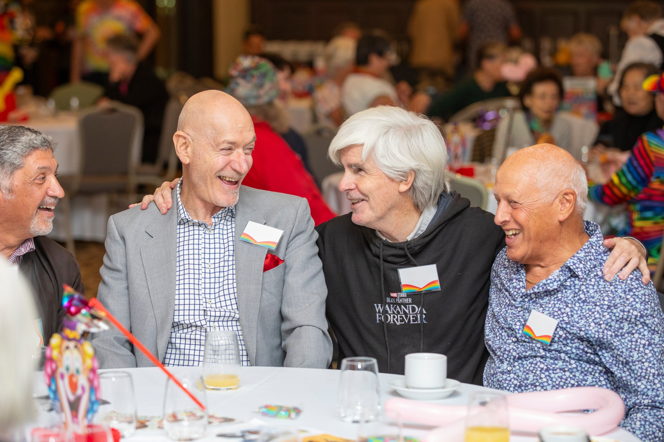Older people sitting around a table 