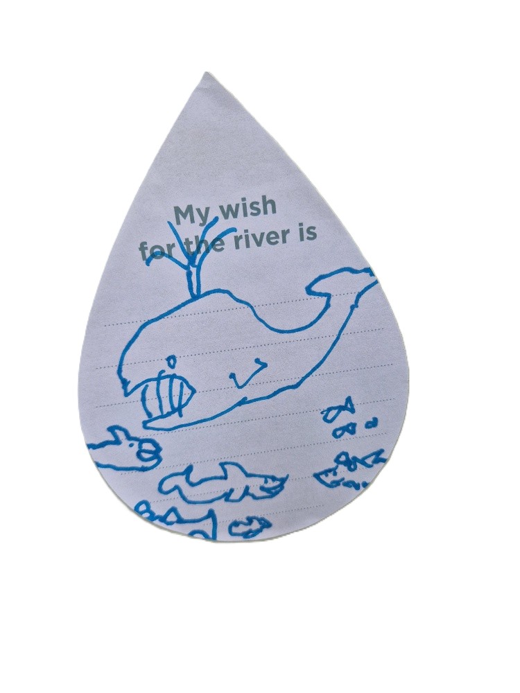 Child's drawing of a whale and fish.