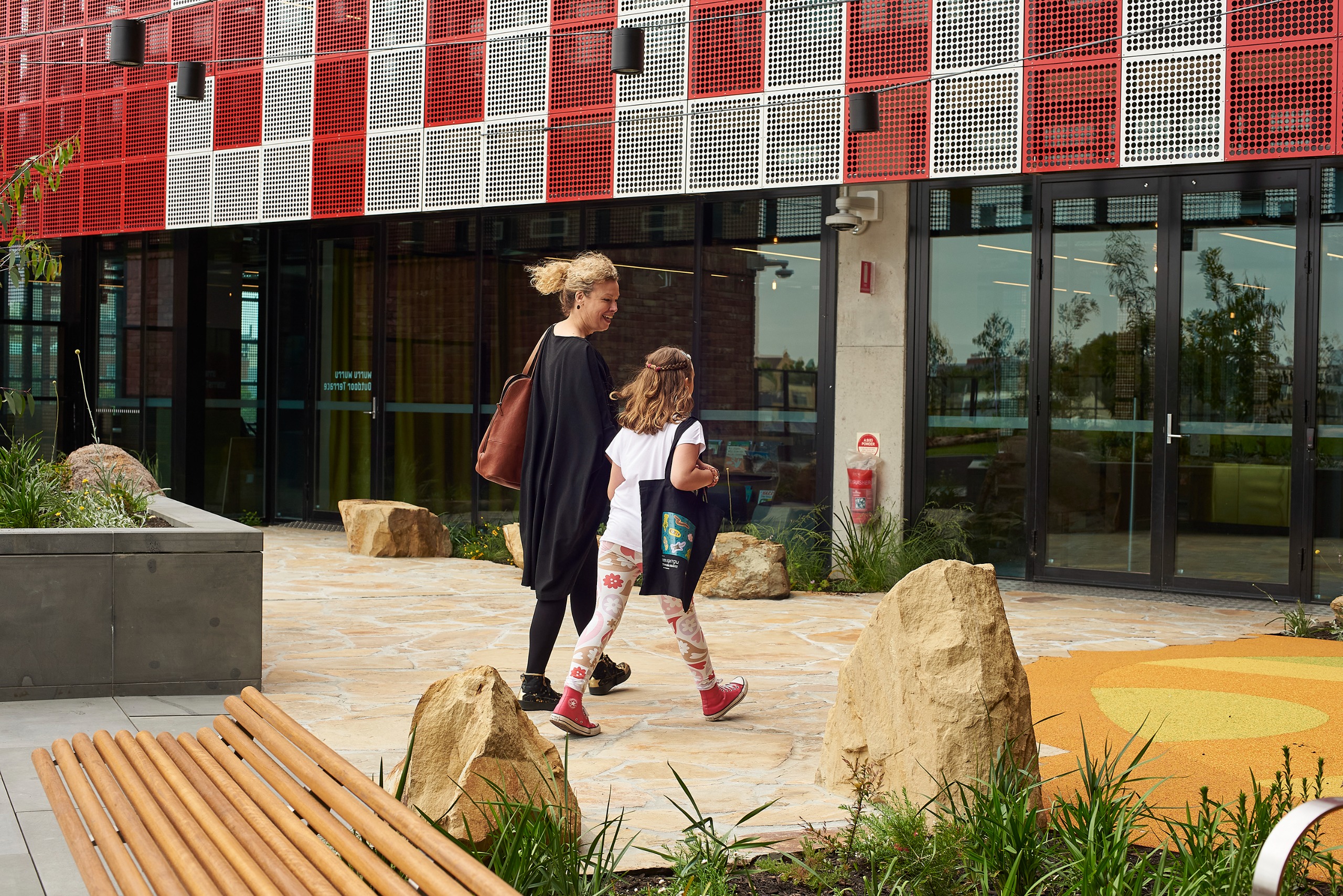 Woman and child walking at Library 